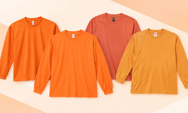 オレンジ・橙色の長袖Tシャツ
